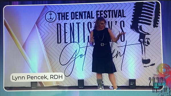 Lynn Pencek giving a seminar at dental festival.
